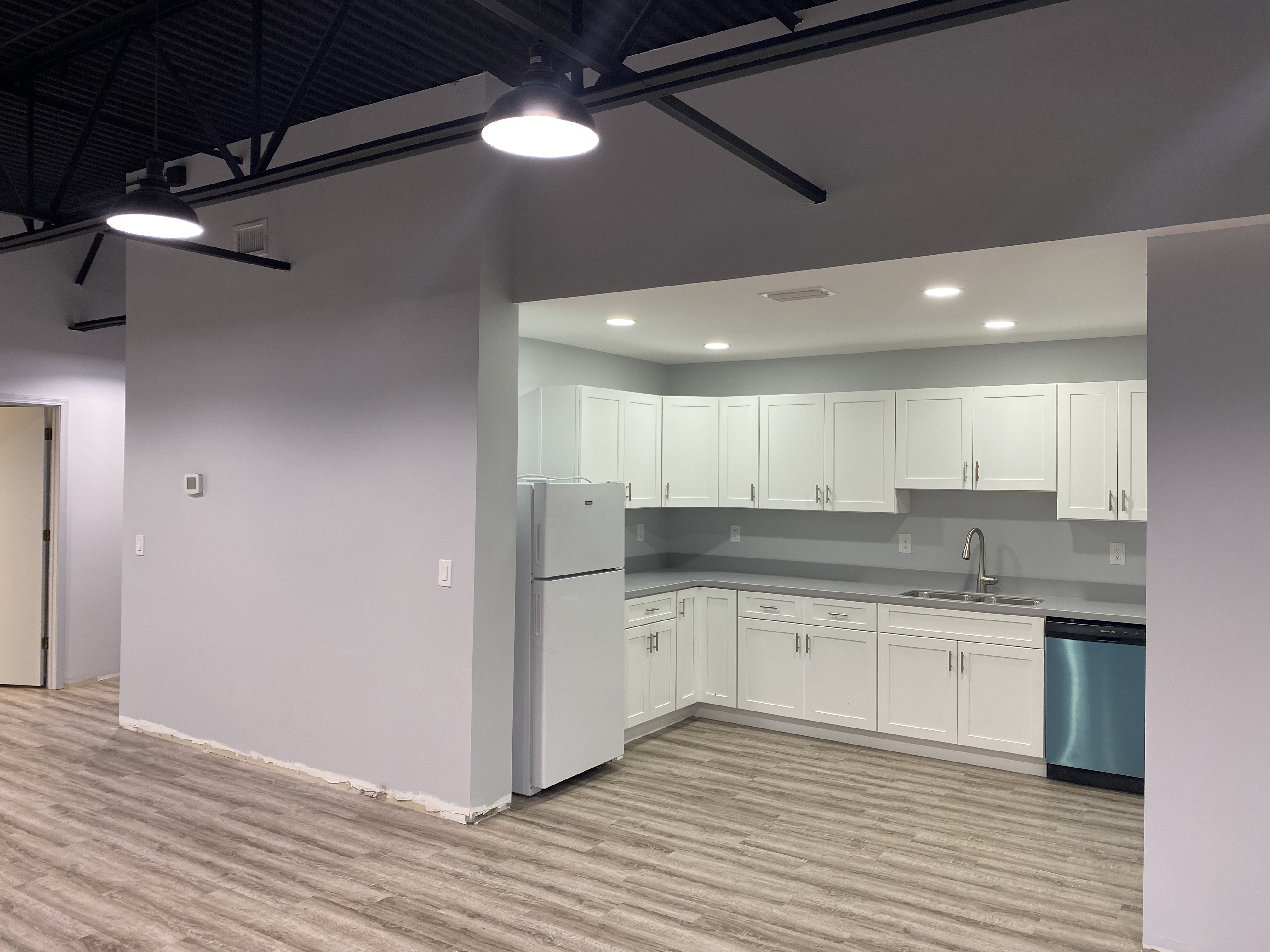 Commercial kitchen build-out with industrial ceiling