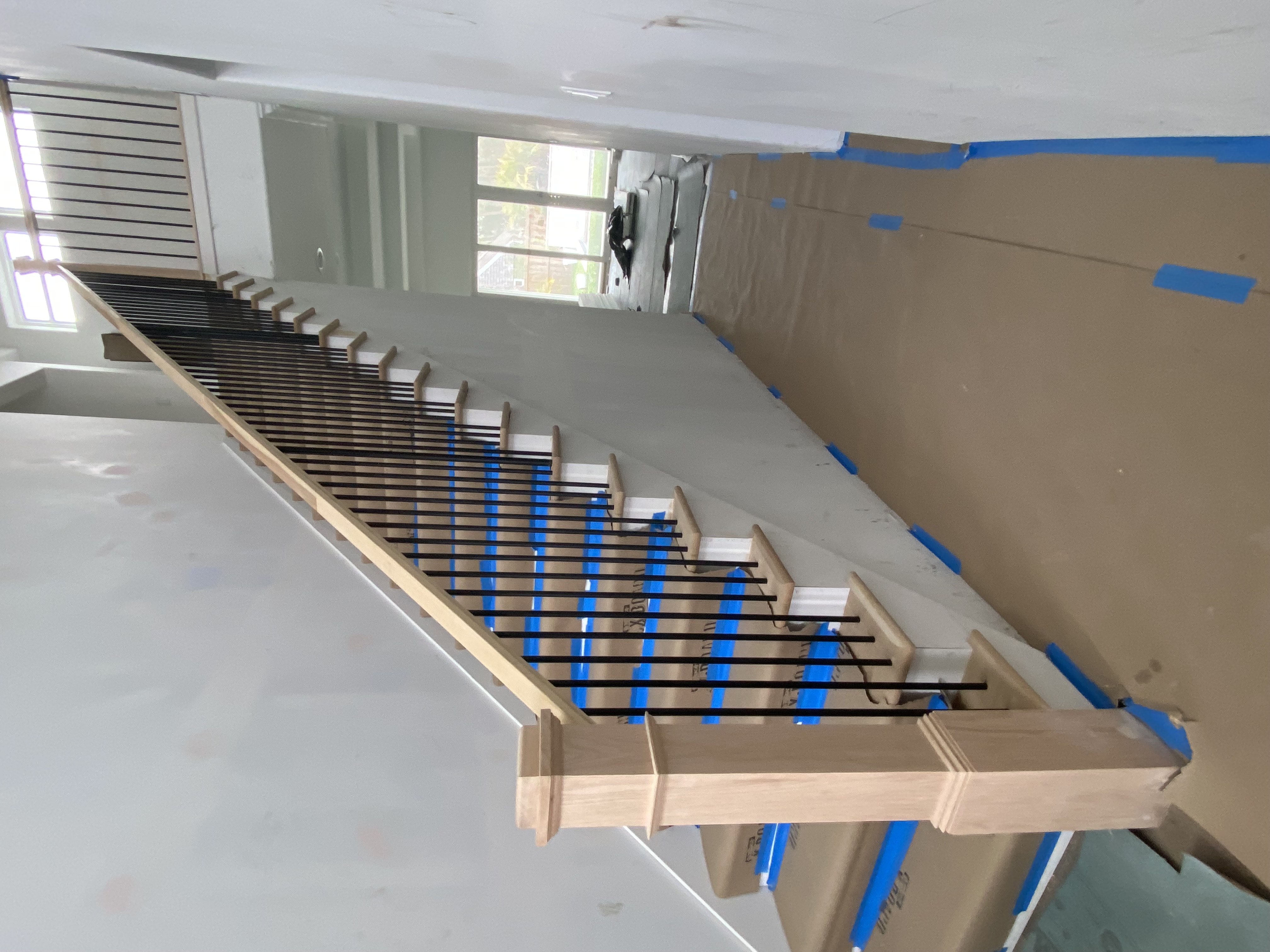 Custom staircase with metal balusters